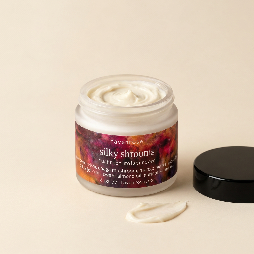 Labeled Silky Shrooms open jar with a butter smear on warm ivory